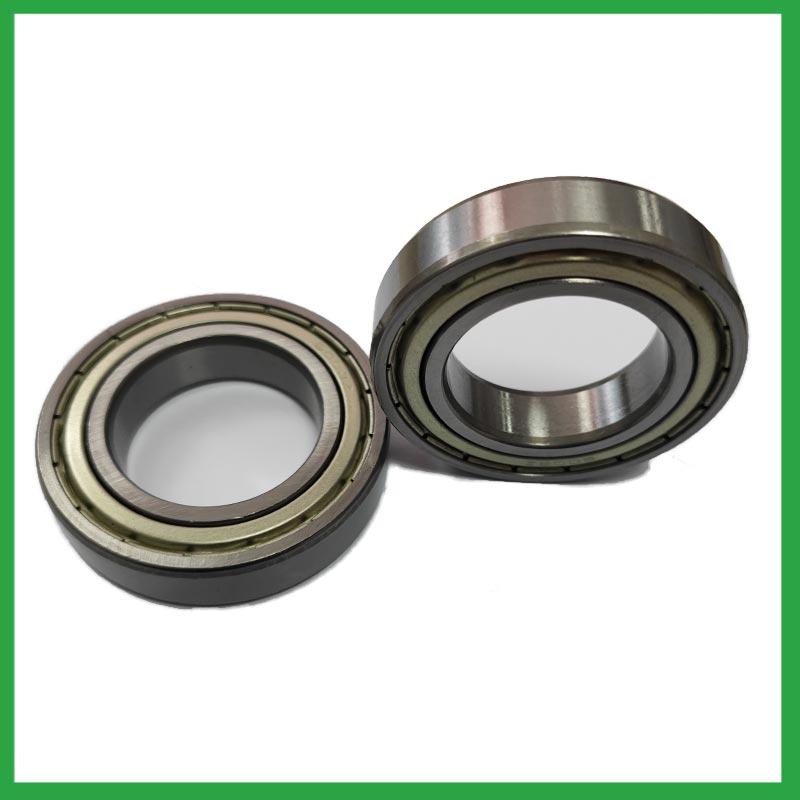 How do sealed ball bearings prevent the ingress of contaminants and extend the bearing's service life?