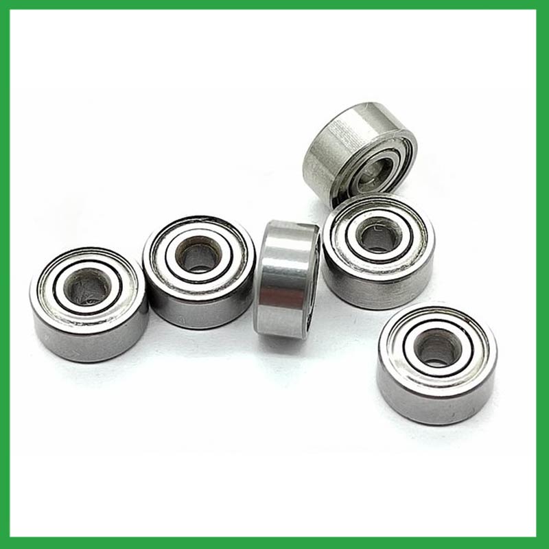 How do ball bearings provide smooth and controlled motion in various mechanical systems, such as conveyor belts or automobiles?